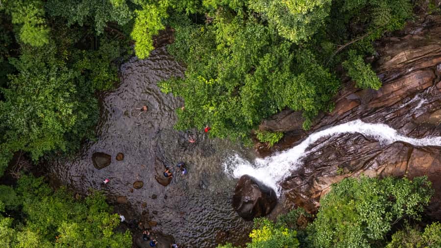 Khao Lak: Elephant Camp, Bamboo Rafting, and Waterfall Tour - Ton Pring Waterfall: A 20-Meter Drop and a Swim in the Lagoon