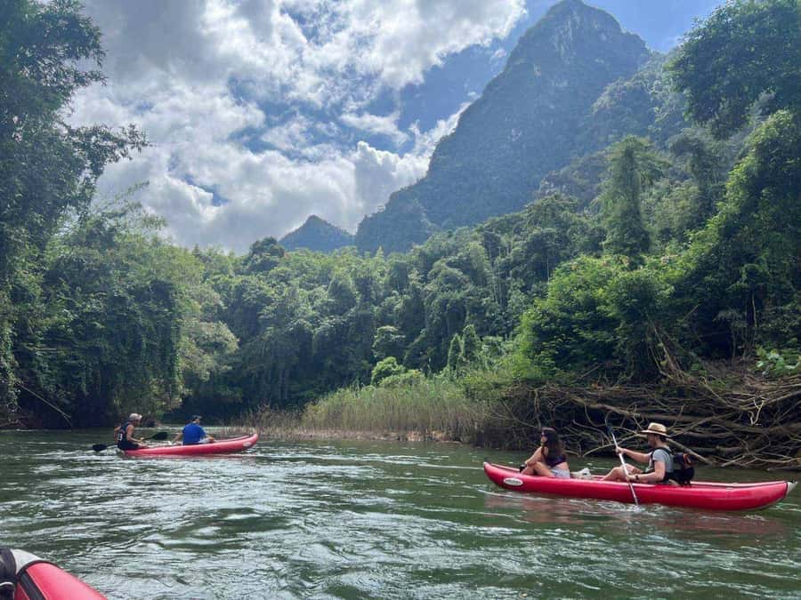Khao Lak: Full-Day Khao Sok Jungle Walk and Canoeing Tour - Wat Tham Pla (Fish Cave Temple): quick culture, temple rules, and a sarong moment