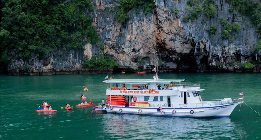 A longtail boat on the jade water of Phang Nga Bay near Khao Lak